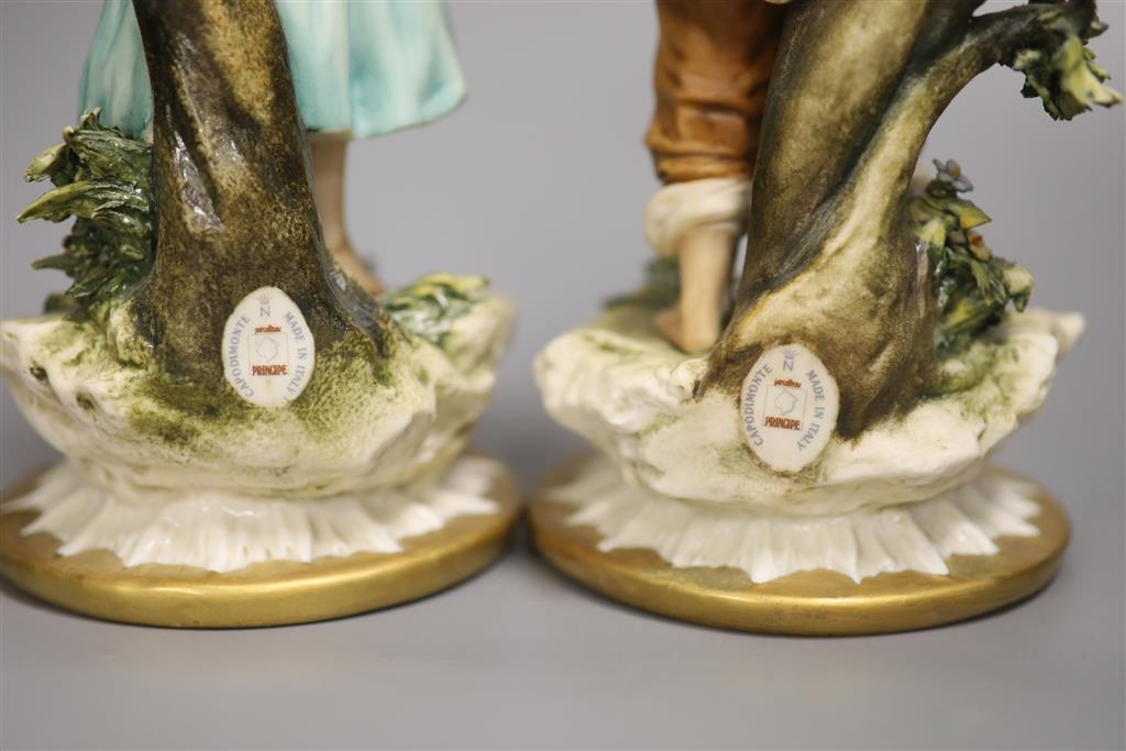 A pair of Capodimonte figures, Boy with Rabbit and Girl with Doves, height 24cm
